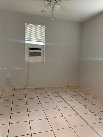 a view of a utility room and window