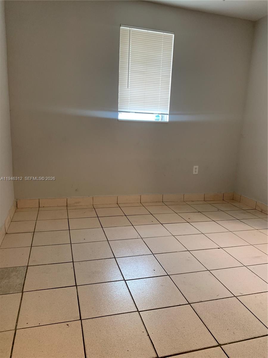 821 Southwest 29th Court, Unit 3 Miami, FL 33135 - Photo 5 of 10 a view of a utility room and window
