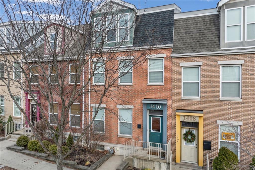 a front view of a multi story residential apartment building