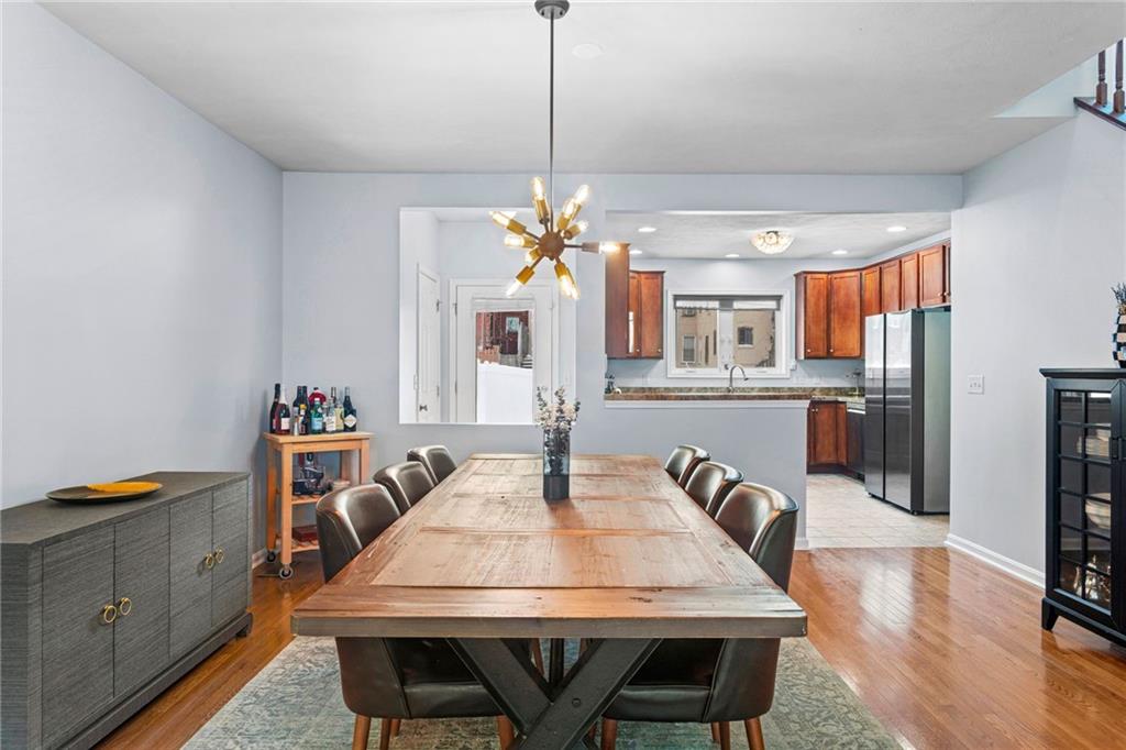 1410 Federal Street Pittsburgh, PA 15212 - Photo 11 of 42 a view of a dining room with furniture and wooden floor