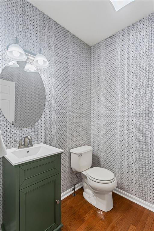 1410 Federal Street Pittsburgh, PA 15212 - Photo 17 of 42 a bathroom with a toilet sink and mirror