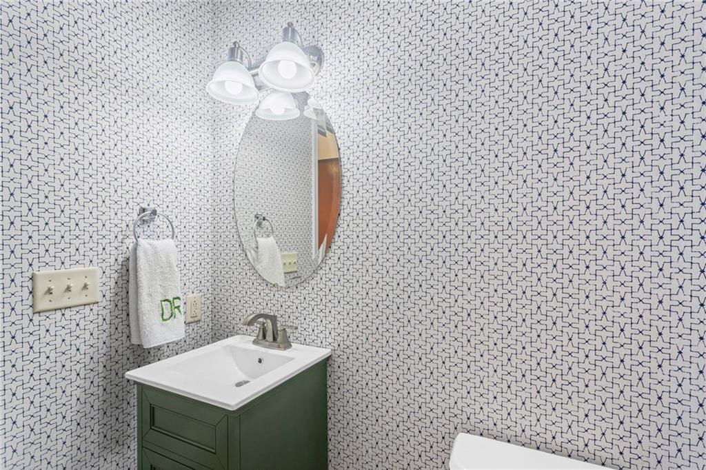 1410 Federal Street Pittsburgh, PA 15212 - Photo 18 of 42 a bathroom with a sink a mirror and a shower