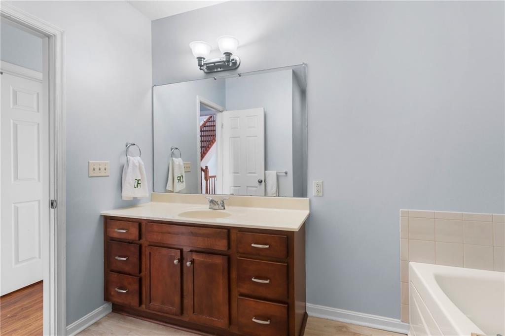 1410 Federal Street Pittsburgh, PA 15212 - Photo 21 of 42 a bathroom with a sink a vanity and mirror