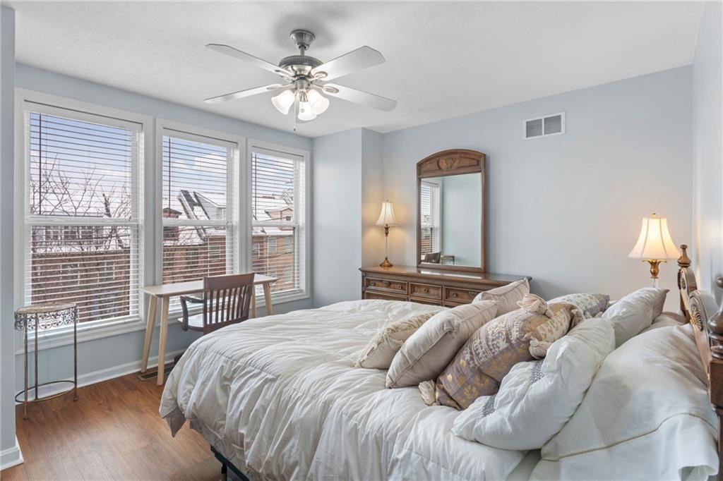 1410 Federal Street Pittsburgh, PA 15212 - Photo 29 of 42 a bedroom with a large bed and a large window