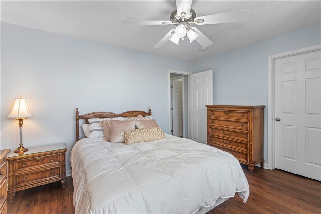 1410 Federal Street Pittsburgh, PA 15212 - Photo 30 of 42 a bedroom with a bed and a chandelier
