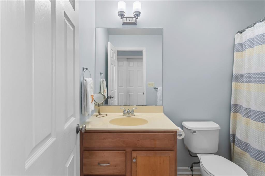 1410 Federal Street Pittsburgh, PA 15212 - Photo 32 of 42 a bathroom with a sink toilet and mirror