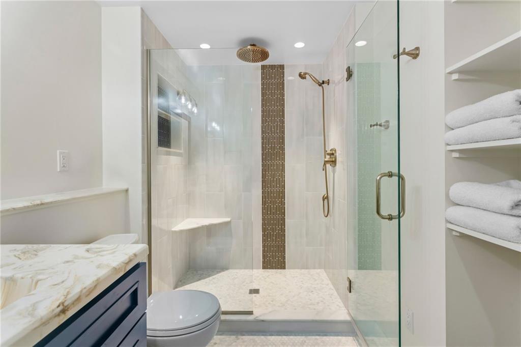 1410 Federal Street Pittsburgh, PA 15212 - Photo 37 of 42 a bathroom with a granite countertop sink toilet and shower