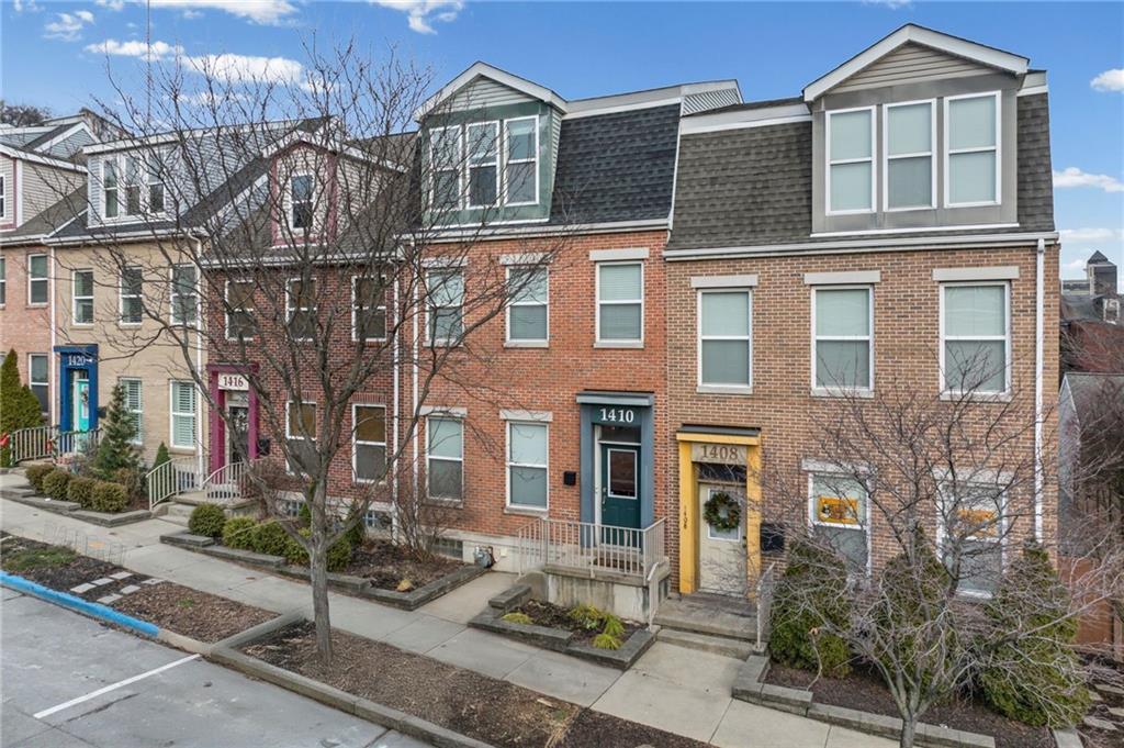 1410 Federal Street Pittsburgh, PA 15212 - Photo 42 of 42 a front view of a residential apartment building with a yard