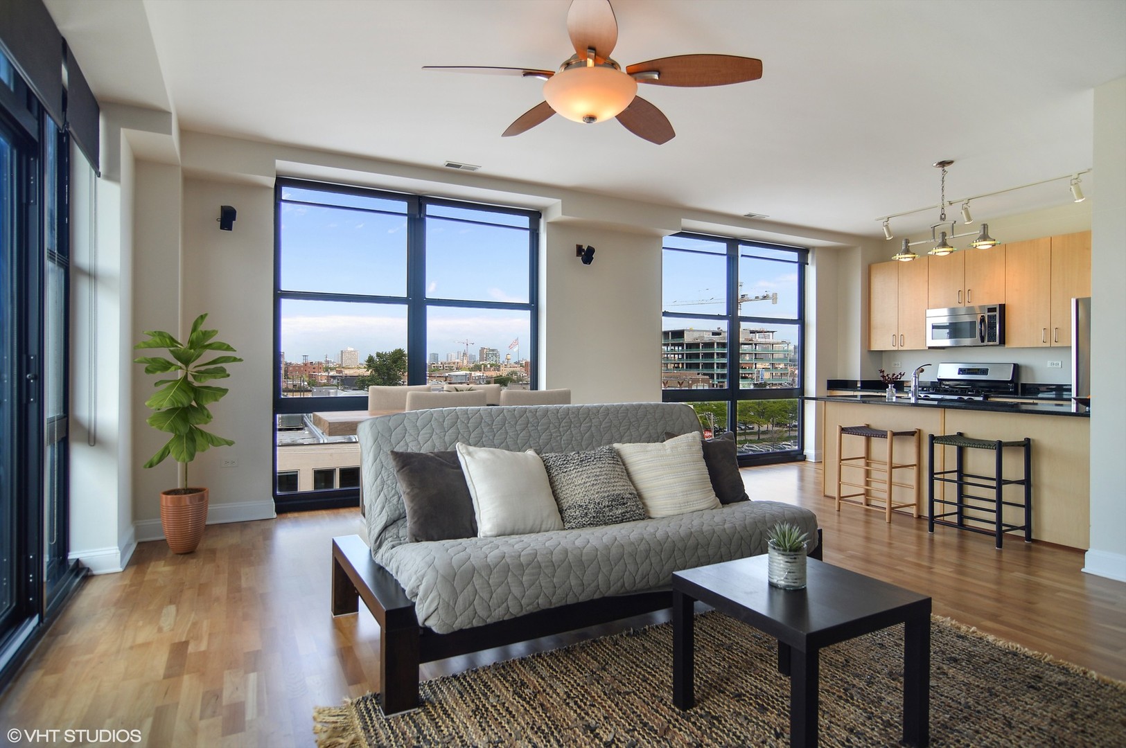 1260 West Washington Boulevard, Unit 508 Chicago, IL 60607 - Photo 4 of 10 a living room with furniture and a large window