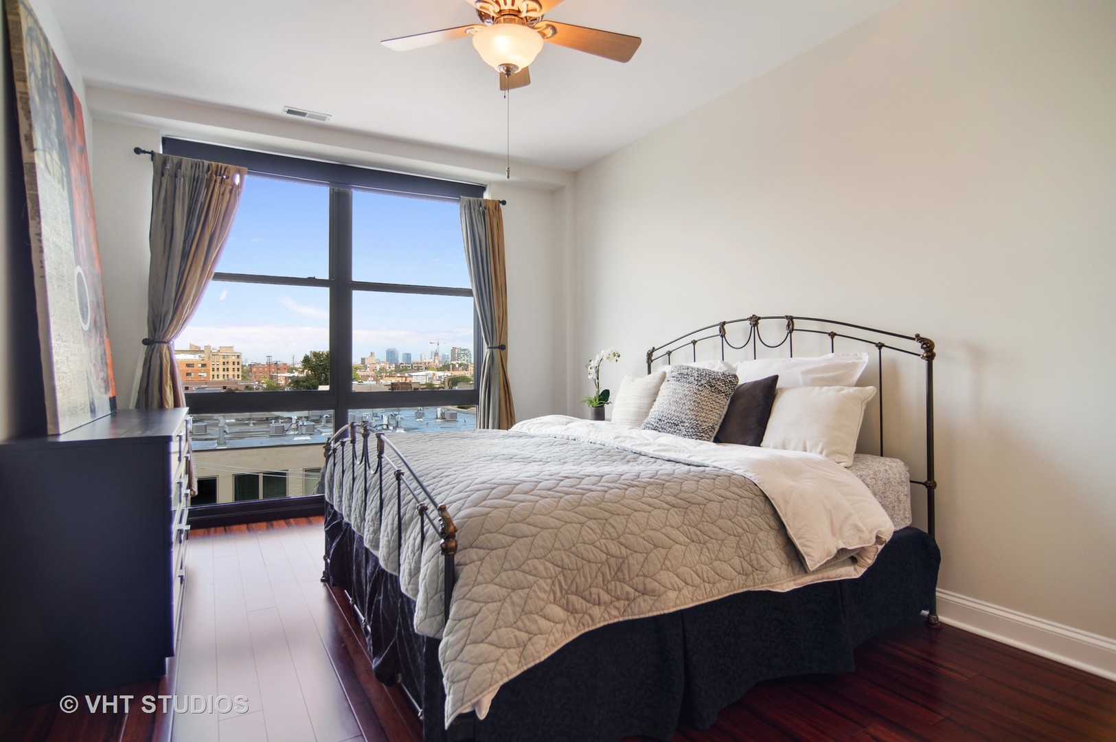 1260 West Washington Boulevard, Unit 508 Chicago, IL 60607 - Photo 6 of 10 a bed sitting in a bedroom next to a window