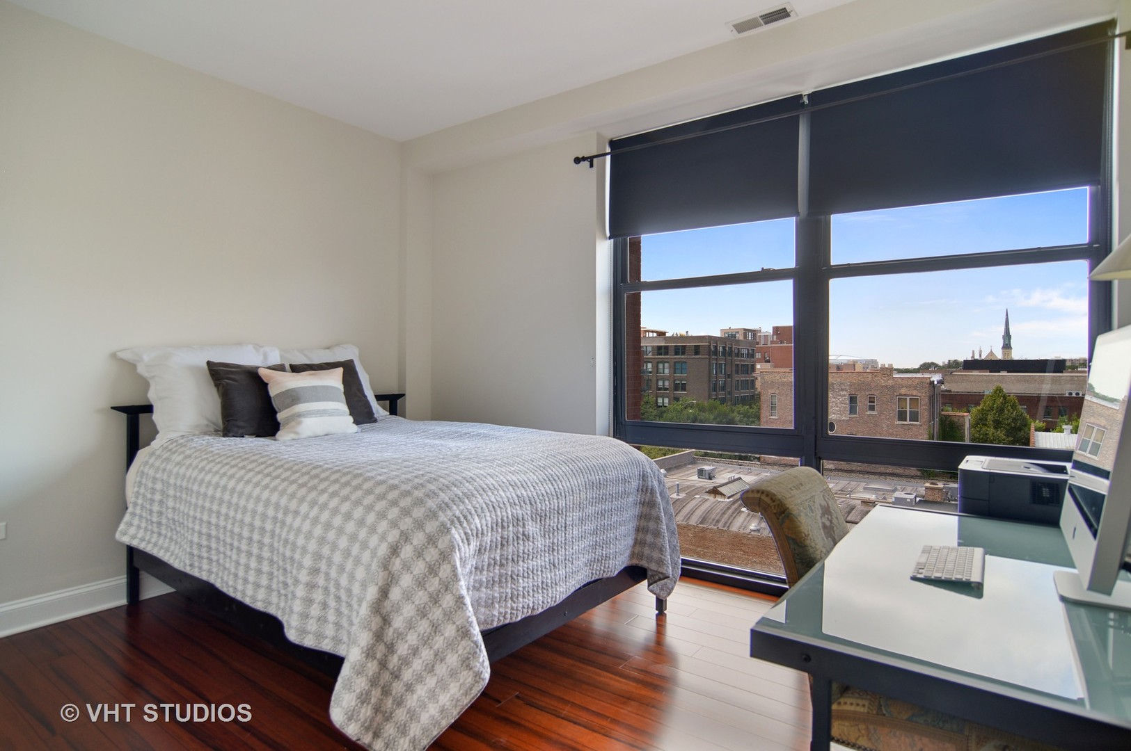 1260 West Washington Boulevard, Unit 508 Chicago, IL 60607 - Photo 8 of 10 a bedroom with a bed and glass window