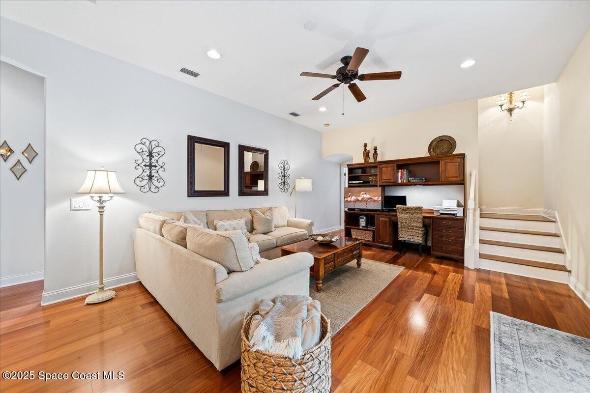 8167 Andover Way Melbourne, FL 32940 - Photo 15 of 78 a living room with furniture and a wooden floor