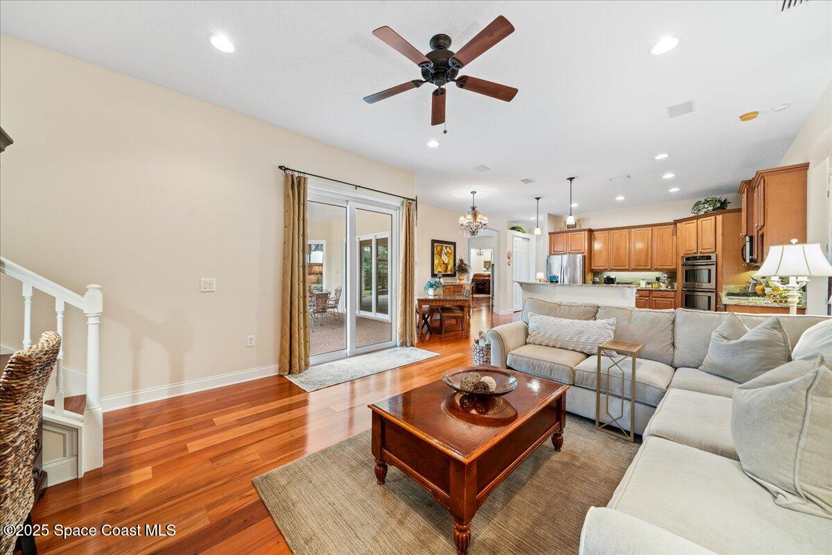 8167 Andover Way Melbourne, FL 32940 - Photo 19 of 78 a living room with furniture kitchen view and a large window