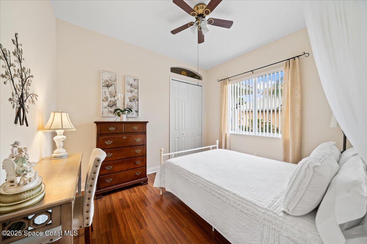 8167 Andover Way Melbourne, FL 32940 - Photo 31 of 78 a bedroom with a bed and a dresser