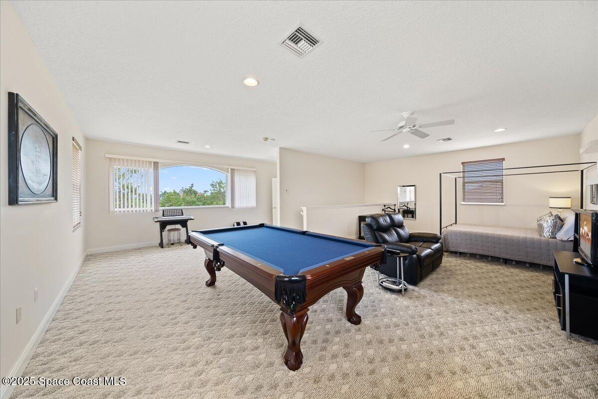 8167 Andover Way Melbourne, FL 32940 - Photo 38 of 78 a living room with furniture a window and a table