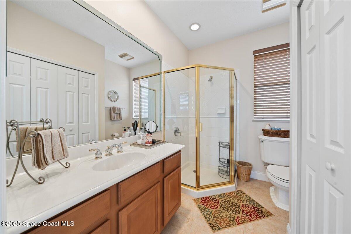 8167 Andover Way Melbourne, FL 32940 - Photo 40 of 78 a bathroom with a sink a toilet and a shower
