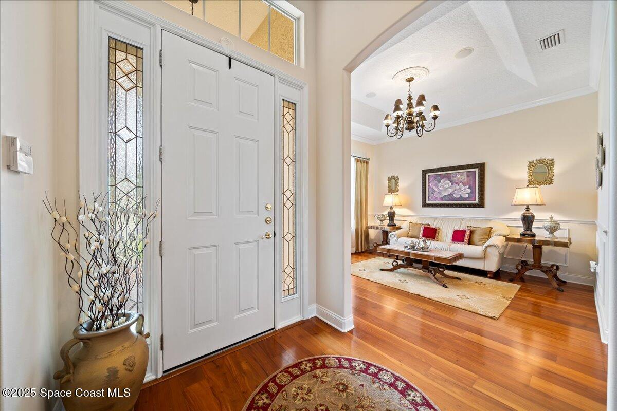 8167 Andover Way Melbourne, FL 32940 - Photo 4 of 78 a living room with furniture and a wooden floor
