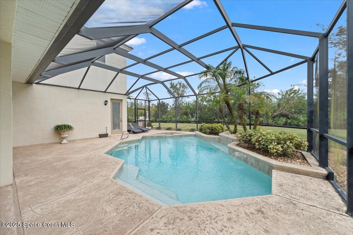 8167 Andover Way Melbourne, FL 32940 - Photo 44 of 78 a view of a swimming pool with a patio