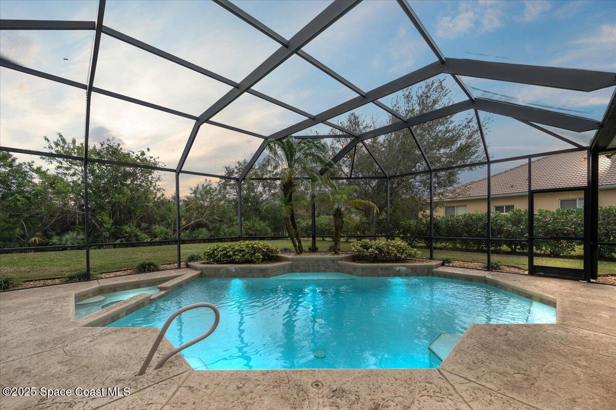 8167 Andover Way Melbourne, FL 32940 - Photo 47 of 78 a view of a swimming pool with a patio