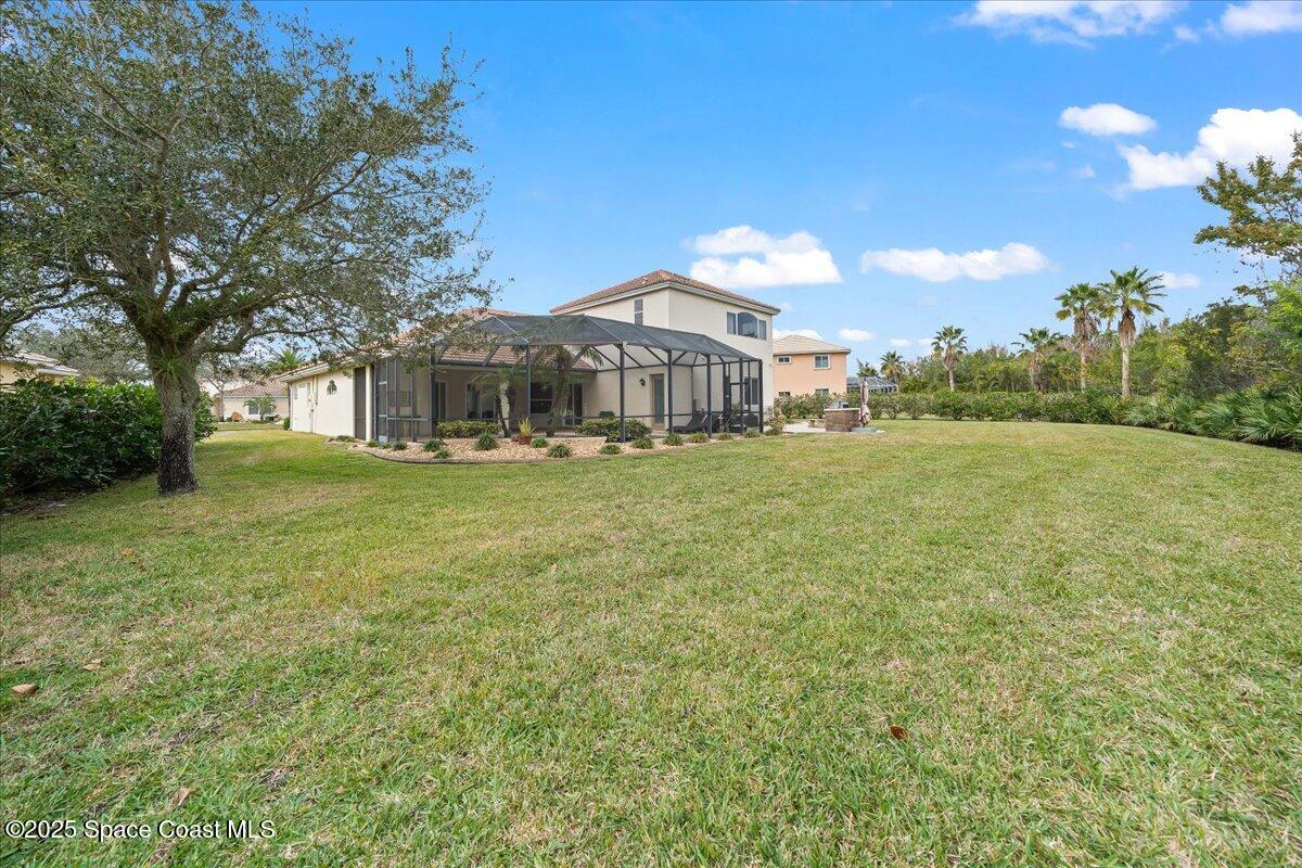 8167 Andover Way Melbourne, FL 32940 - Photo 54 of 78 a view of a house with a big yard