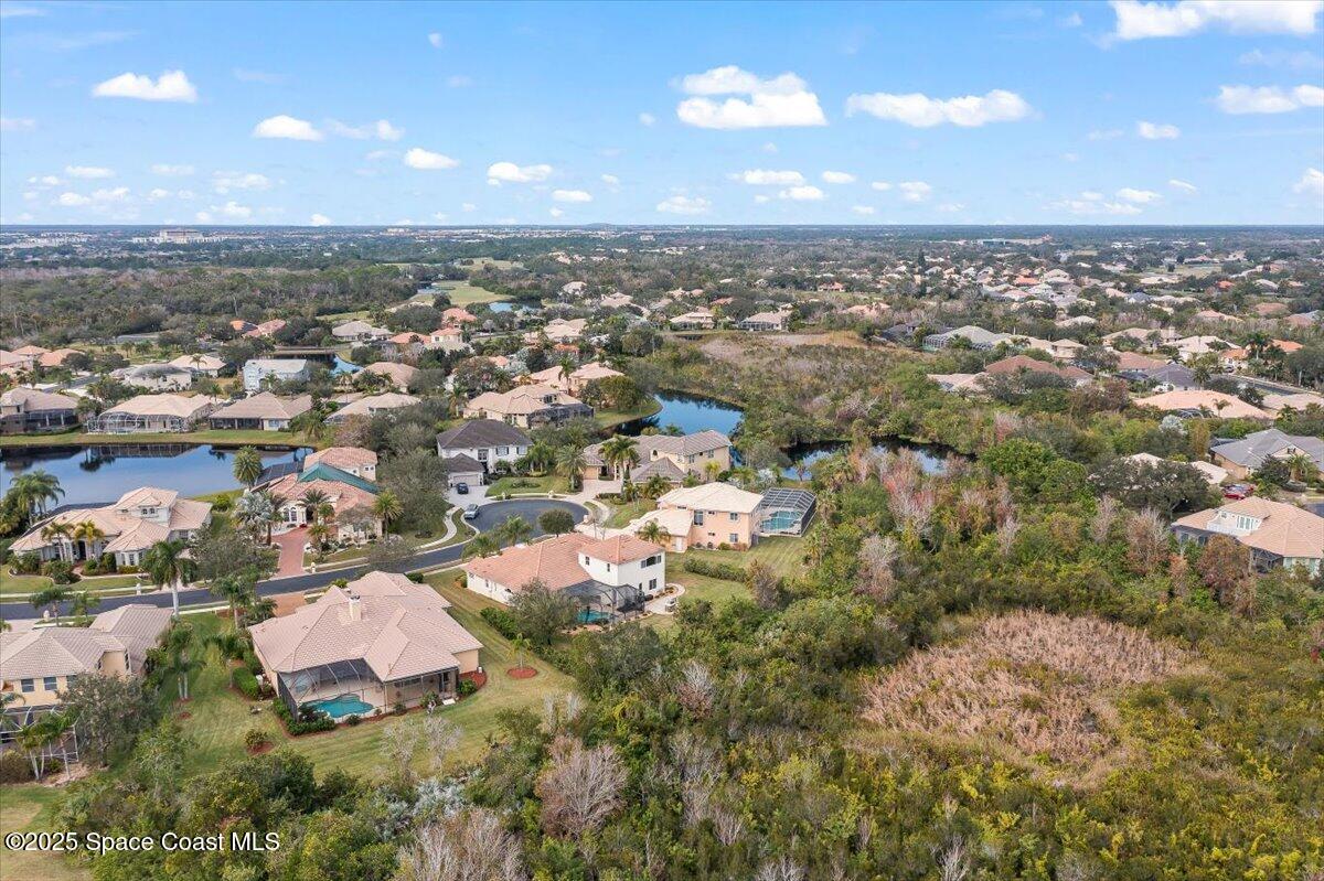 8167 Andover Way Melbourne, FL 32940 - Photo 61 of 78 an aerial view of residential houses with outdoor space and trees