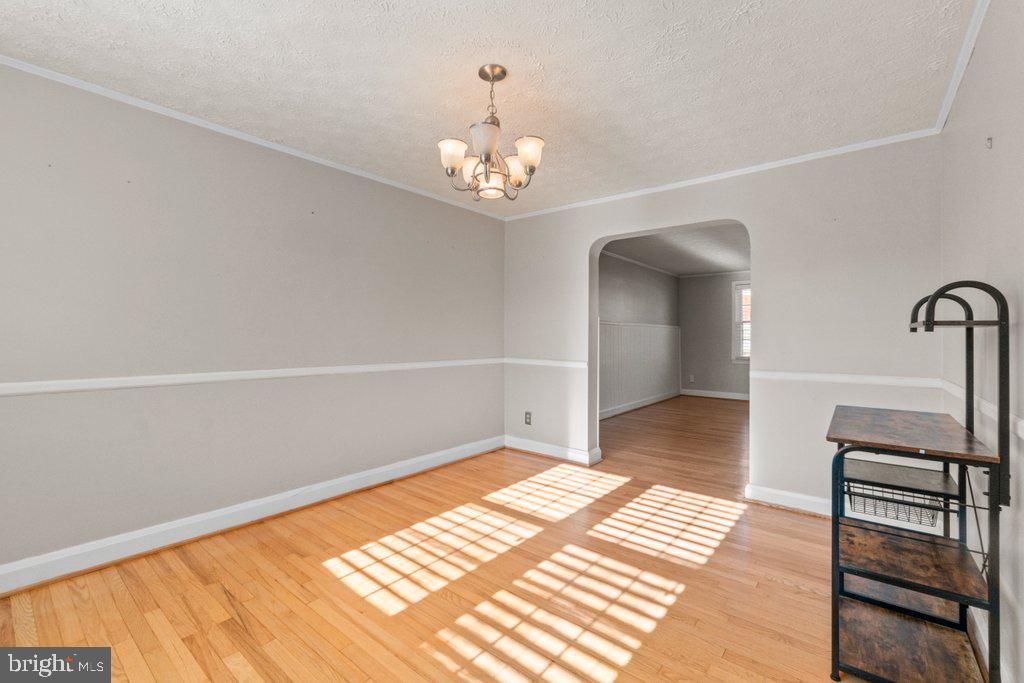 1529 Cottage Lane Towson, MD 21286 - Photo 15 of 43 a view of an empty room with wooden floor and a window