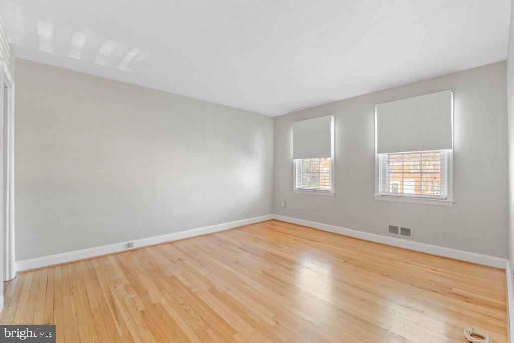 1529 Cottage Lane Towson, MD 21286 - Photo 21 of 43 wooden floor in an empty room with a window