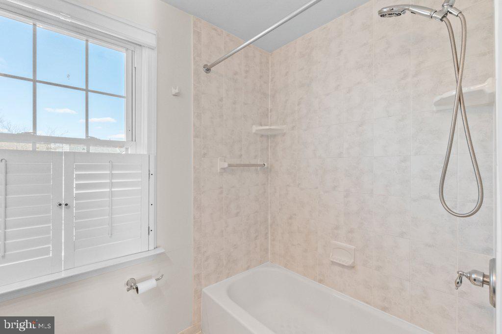 1529 Cottage Lane Towson, MD 21286 - Photo 30 of 43 a bathroom with a bath tub and a shower