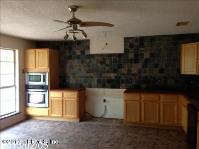 832 Worth Road Jacksonville, FL 32259 - Photo 2 of 27 a kitchen with a sink and cabinets