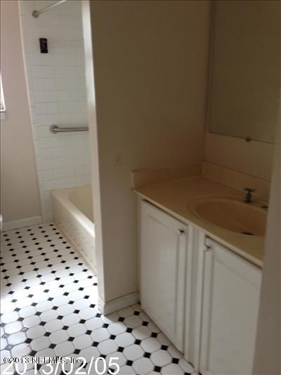 832 Worth Road Jacksonville, FL 32259 - Photo 22 of 27 a bathroom with a shower and a sink
