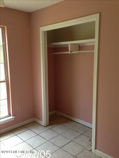 832 Worth Road Jacksonville, FL 32259 - Photo 26 of 27 an empty room with windows