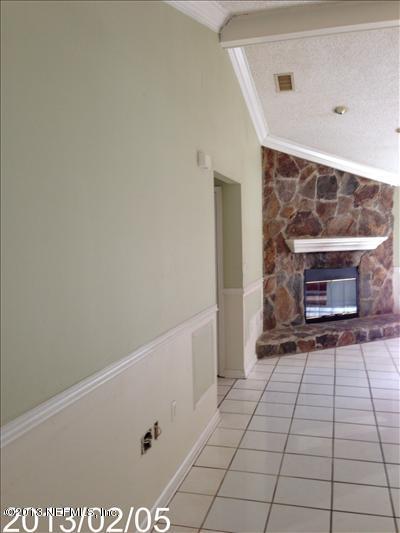 832 Worth Road Jacksonville, FL 32259 - Photo 10 of 27 a view of an empty room with a fireplace