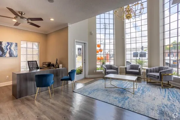 a living room with furniture and a large window