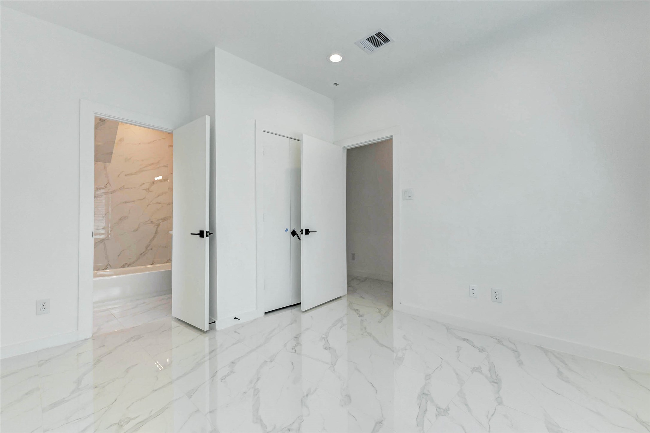 6017 Beall Street Houston, TX 77091 - Photo 20 of 33 Retreat to spacious bedrooms with bright natural light, polished tile floors, and a seamless connection to spa-like bathrooms designed for comfort and styled for luxury.