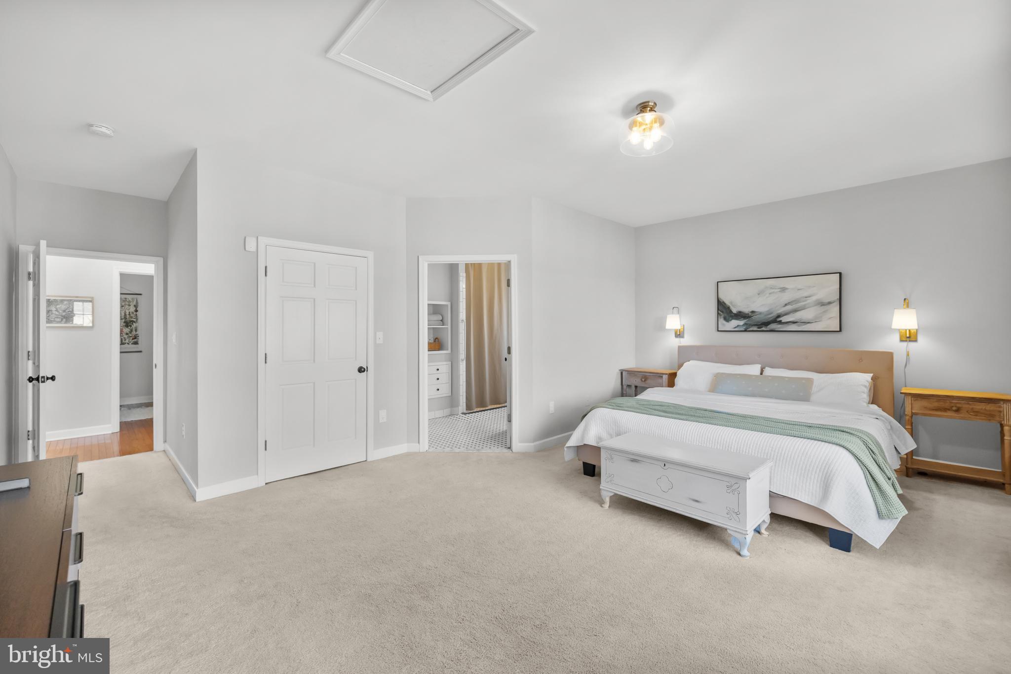 15657 Purcellville Road Purcellville, VA 20132 - Photo 24 of 72 a spacious bedroom with a bed and a lamp
