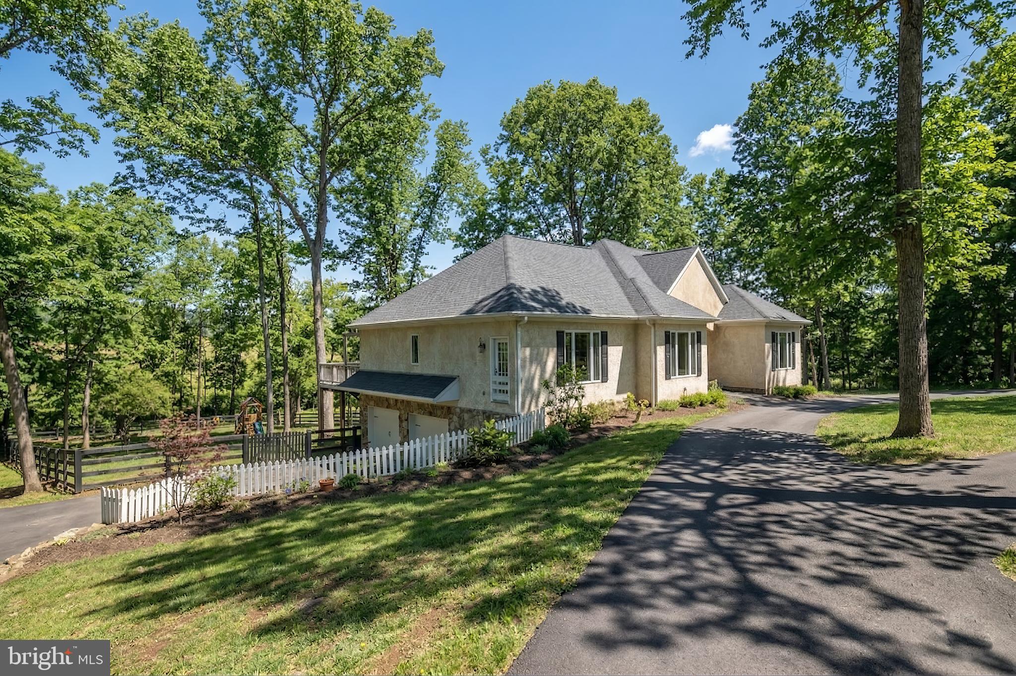 15657 Purcellville Road Purcellville, VA 20132 - Photo 50 of 72 a backyard of a house with yard and outdoor seating