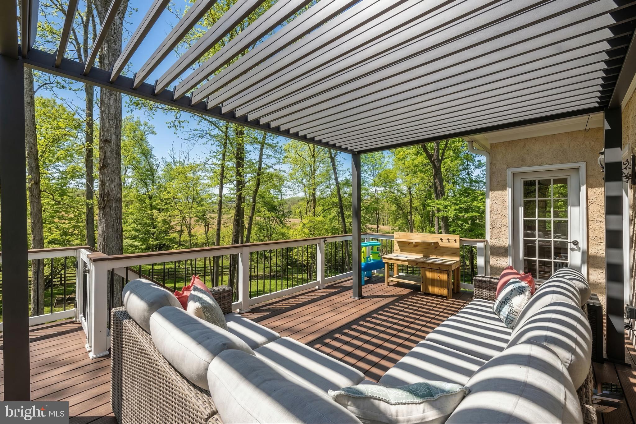 15657 Purcellville Road Purcellville, VA 20132 - Photo 56 of 72 a view of balcony with couch and wooden floor