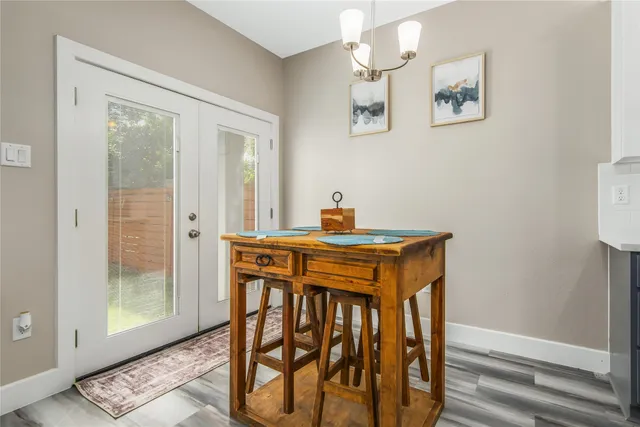 a bedroom with a bed window and a table