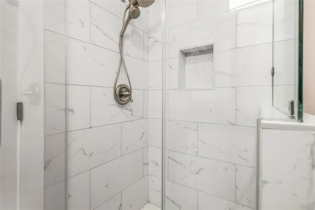 a en suite bathroom with a sink and a mirror