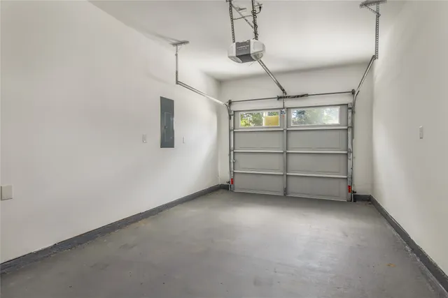 a view of a house with a yard and a garden