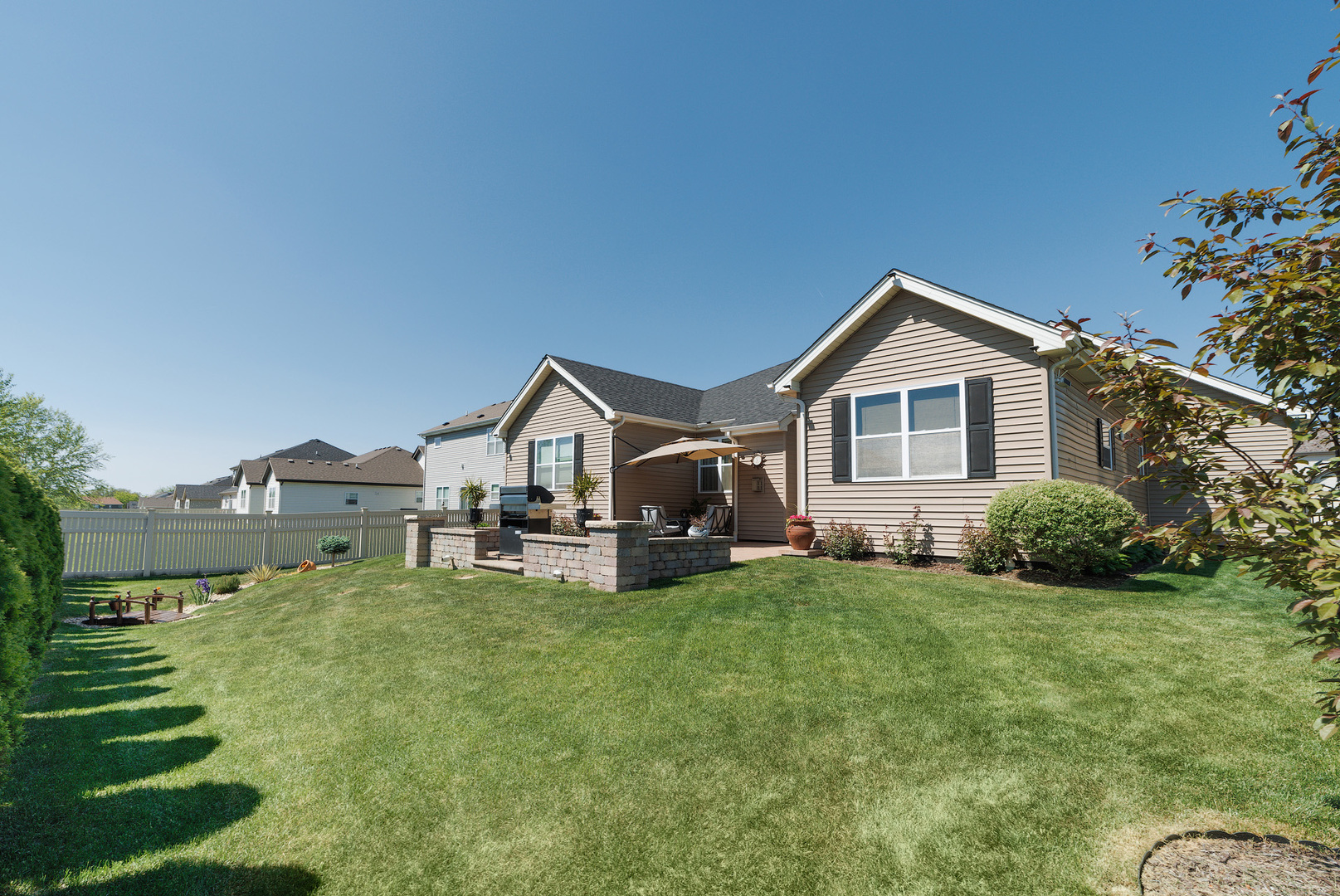 743 North Misty Ridge Drive Romeoville, IL 60446 - Photo 2 of 22 a front view of a house with a yard and garage