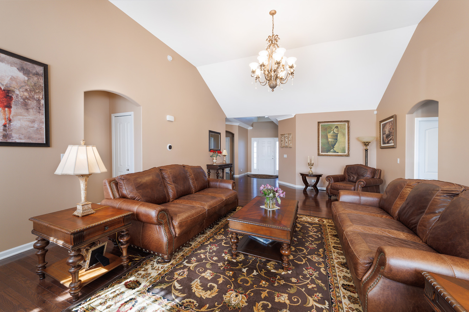743 North Misty Ridge Drive Romeoville, IL 60446 - Photo 6 of 22 a living room with furniture a chandelier and a rug