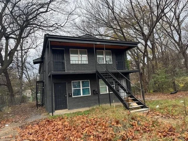 a house with trees in front of it