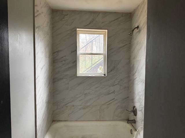 1627 Barton Street Memphis, TN 38106 - Photo 7 of 15 a bathroom with a bathtub and shower