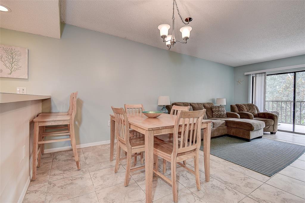 12900 Vonn Road, Unit C202 Largo, FL 33774 - Photo 12 of 38 a view of a dining room with furniture