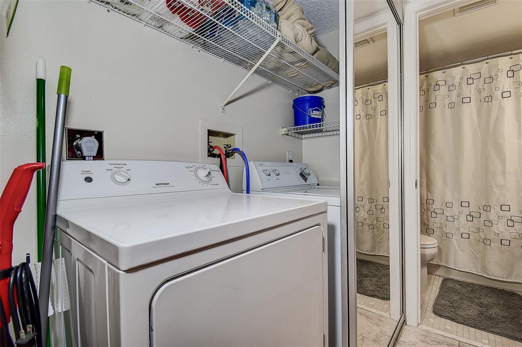 12900 Vonn Road, Unit C202 Largo, FL 33774 - Photo 28 of 38 a utility room with dryer and washer