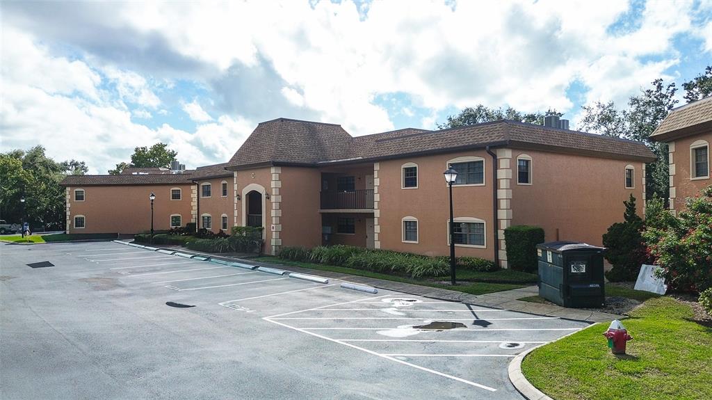 12900 Vonn Road, Unit C202 Largo, FL 33774 - Photo 32 of 38 a backyard of a house with seating space