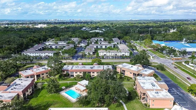 an aerial view of residential building and lake