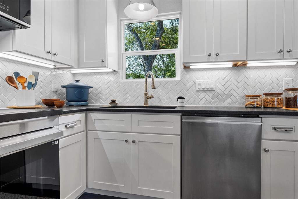 4229 Fort Avenue Waco, TX 76710 - Photo 12 of 40 a kitchen with a sink cabinets and window