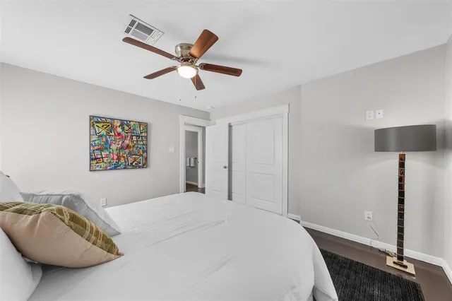a living room with a table chairs and a window